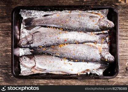 The raw trout prepared for baking close up