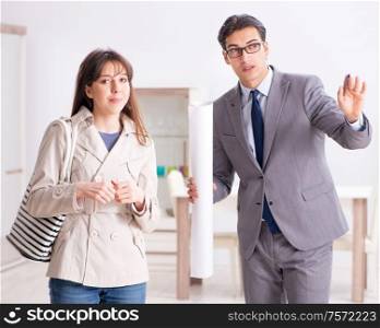 The real estate agent showing new apartment property to client. Real estate agent showing new apartment property to client