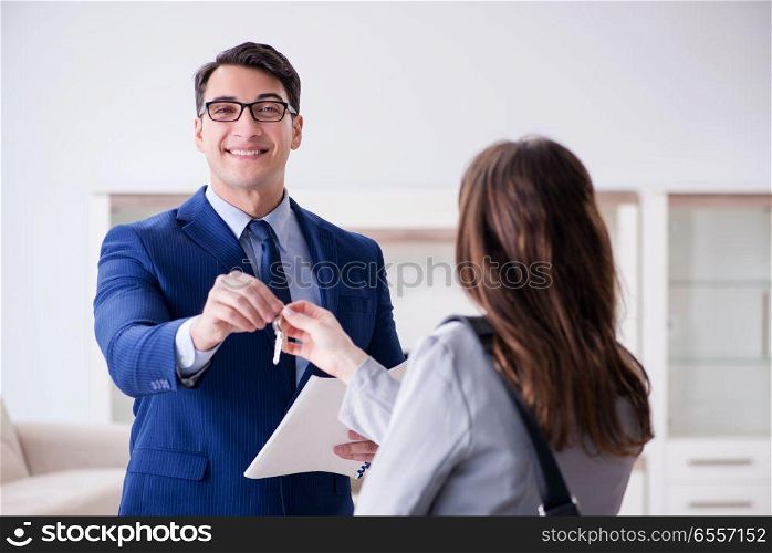The real estate agent showing new apartment to owner. Real estate agent showing new apartment to owner