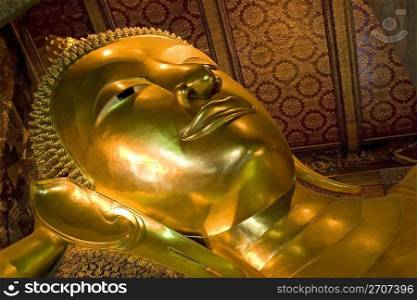 The reclining Buddha in Wat Pho temple, Thailand. Reclining Buddha