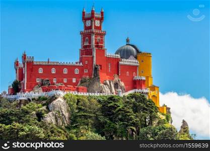 The red and yellow walls and towers of Pena Palace, Sao Pedro de Penaferrim, Sintra, Portugal