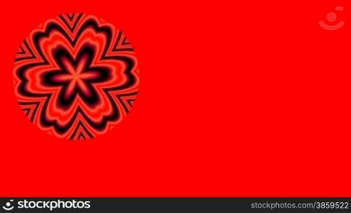 The red ornament rotates on a red background