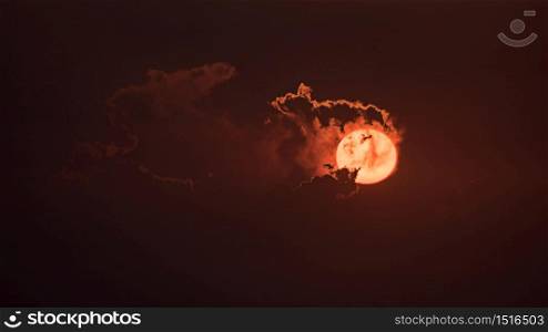 The red sun in the evening with cloud