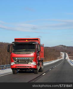 The red truck on a winter road.