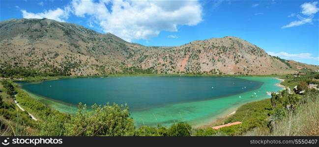 The remarkable emerald-green Lake Kournas on Crete, Greece, which is the island&rsquo;s only permanent, natural fresh-water lake, being fed by springs from the Lefki Ora (White Mountains) beyond.