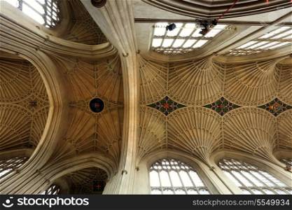 The remarkable fan-vaulted ceiling of Bath Abbey, in Gloucestershire, England. Fan vaulting is a specifically English type of architecture. The Bath Abbey ceiling was constructed in 1608 and restored in 1860. It incorporares various armorial designs, including an early 17th century version of the Royal Coat of Arms on the right of this image.