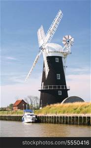 The restored water pump windmill at Berney Arms in Norfolk, England, a part of the country that has been reclaimed from marshland.