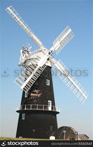 The restored water pump windmill at Berney Arms in Norfolk, England, a part of the country that has been reclaimed from marshland.
