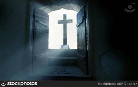 The Resurrection of Jesus Christ. Religious Easter background, with strong light rays shining through the entrance to an empty stone tomb.