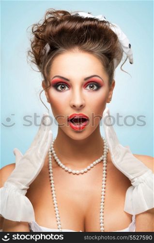 The retro photo of a shocked and surprised bride with stylish makeup in a showing strong emotions.