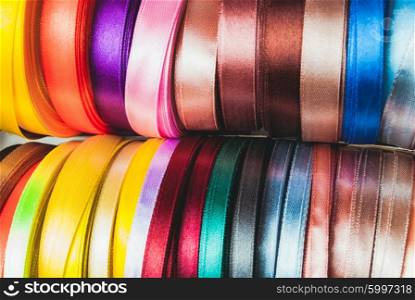 The ribbon spools. The many-coloured ribbon spools in the craft