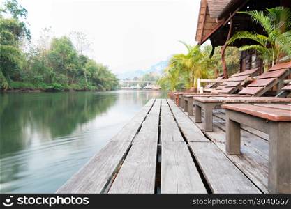 the river Kwai view at rafting cottage terrace on sunset