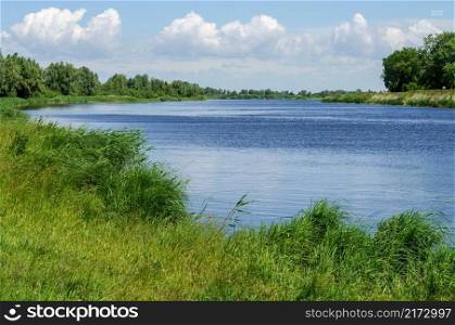 The river or for fishing. View of the river from afar. Landscape of a beautiful natural river.. The river or for fishing. Landscape of a beautiful natural river.
