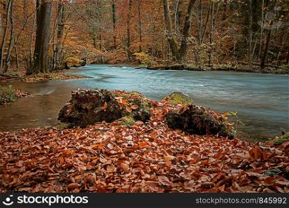 the river Wuerm in autumn Bavaria long-term exposure