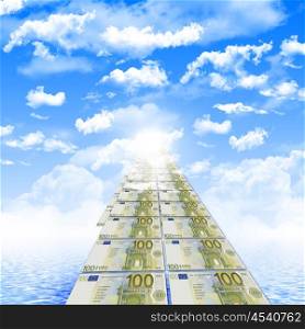 The road from banknotes disappearing into a bright blue sky. symbol of success