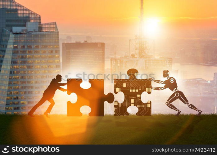 The robot and human cooperating in jigsaw puzzle. Robot and human cooperating in jigsaw puzzle