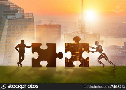 The robot and human cooperating in jigsaw puzzle. Robot and human cooperating in jigsaw puzzle