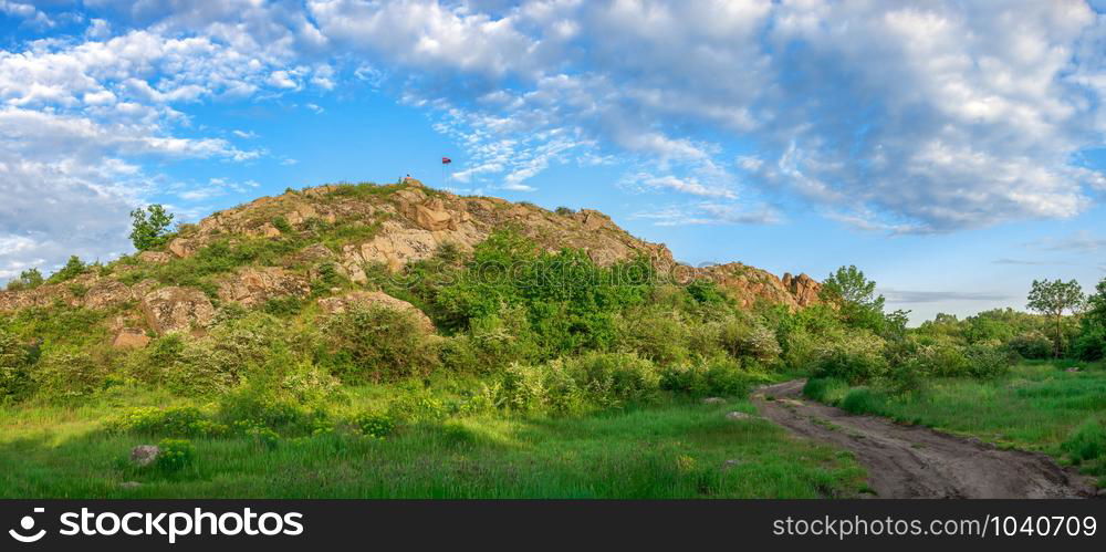 The rocky banks of the Southern Bug River near the village of Migiya in Ukraine on a sunny summer day. The beauty of nature in Migiya, Ukraine