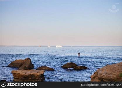 The rocky coast of the Black Sea in the Odessa region in Ukraine, view of the yachts. The rocky coast of the Black Sea in the Odessa region in Ukraine, view of the yachts.