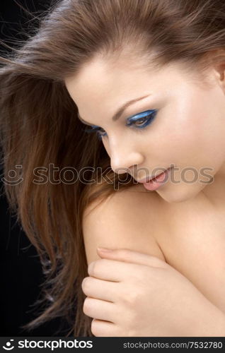 The romantic beautiful girl with a make-up in blue tones