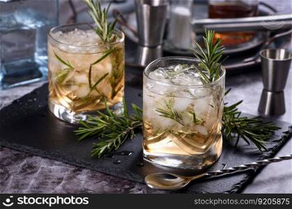 The Rosemary Vodka cocktail consists of maple syrup with a small amount of salt, rosemary, crushed ice and vodka. Vodka can be replaced with other alcohol - tequila, white rum, gin.  ?