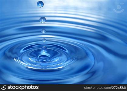 The round transparent drop of water, falls downwards...