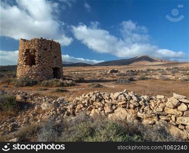 The ruin of an old windmill on the island of Fuerteventura in the Spanish Canary Islands in the North Atlantic.