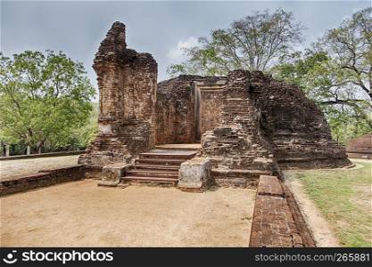 The ruins of an old stone shrine in the Potgul Vihara monastery area of the ancient city of Polonnaruwa in Sri Lanka.