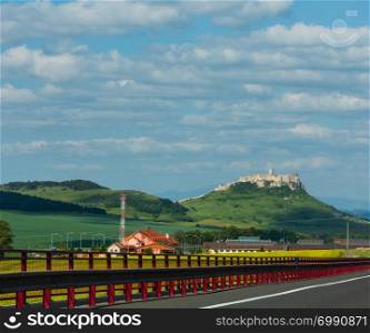 The ruins of Spis Castle or Spissky hrad in eastern Slovakia. Summer panorama view from highway. Built in the 12th century.