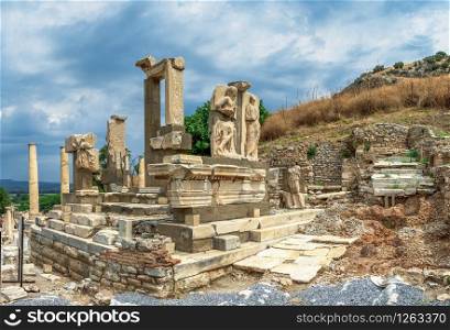The Ruins of The Polyphemus statues of Pollio Fountain in antique Ephesus city, Turkey, on a sunny summer day. Polyphemus statues in the ancient Ephesus, Turkey