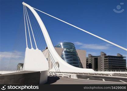 The Samuel Beckett Bridge is the newest bridge to cross the River Liffey in Dublin, Ireland. The modern structure is curved in the shape of a harp and uses cables, like a suspension bridge, to maintain the structure.