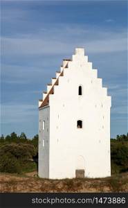 The sand covered church in Skagen, Denmark