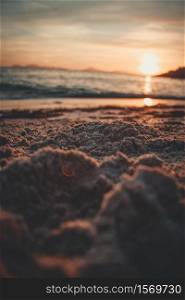 The sand of the beach during a sunset