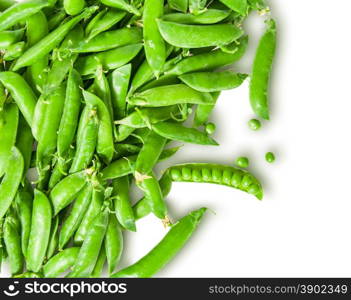 The scattered pods of green peas isolated on white background