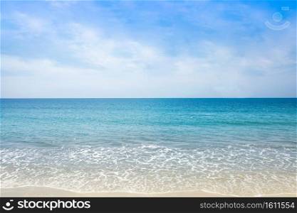 The Scenic beach in a Thailand tropical sea at summer season with a calm waves and blue sky for relax in holiday