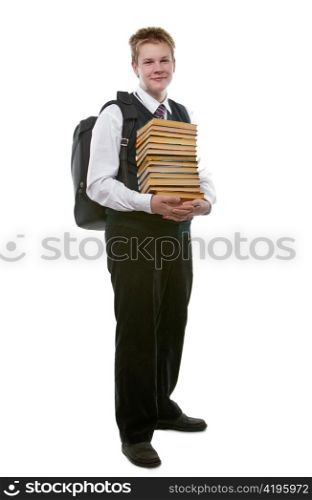 The schoolboy in a school uniform with a huge pack of books