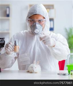 The scientist doing animal experiment in lab with rabbit. Scientist doing animal experiment in lab with rabbit