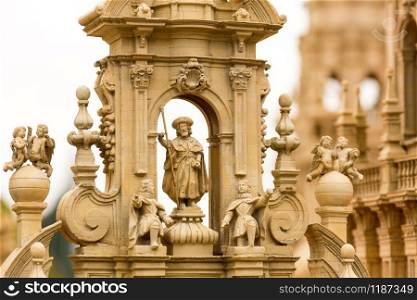 The sculptures decorating the ancient building, miniature scene outdoor, europe. Mini figures with high detaling of objects, realistically diorama, toy model