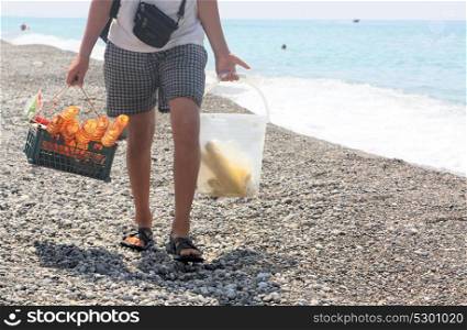 The seller of chips and corn on the Abkhazian beach - Gagra 2017