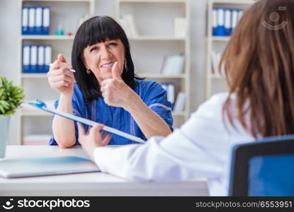 The senior patient visiting doctor for regular check-up. Senior patient visiting doctor for regular check-up