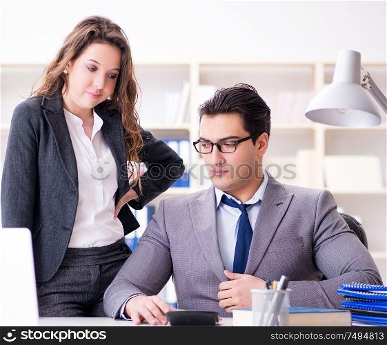 The sexual harassment concept with man and woman in office. Sexual harassment concept with man and woman in office