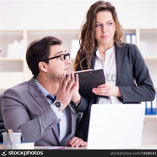 The sexual harassment concept with man and woman in office. Sexual harassment concept with man and woman in office