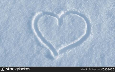 The shape of heart drawing on the white snow