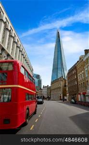 The Shard and old London red Bus in England