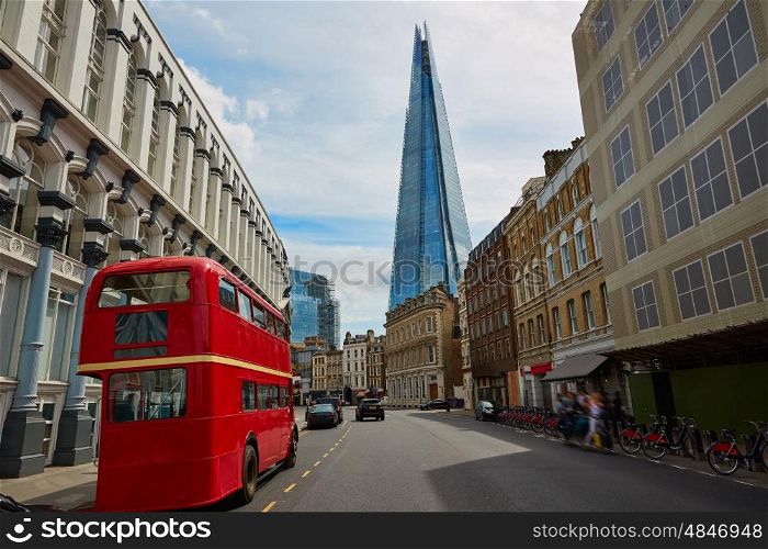 The Shard and old London red Bus in England