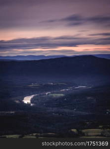 The Shenandoah River snaking its way through the Shenandoah Valley as seen from Skyline Drive in Shenandoah National Park at sunset.
