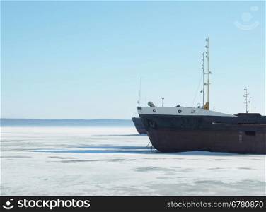 The ships on the frozen lake in the winter in Petrozavodsk, Russia