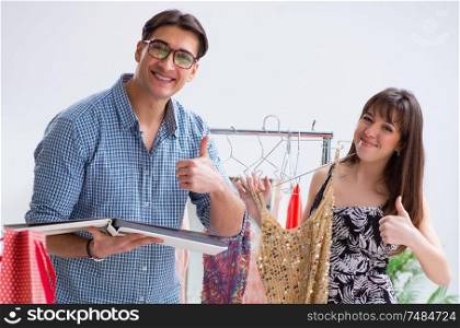 The shop assistant helping woman with buying choice. Shop assistant helping woman with buying choice