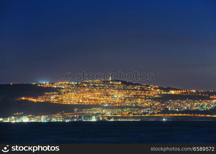 The shore of Lake Kinneret and the city of Tiberias at night