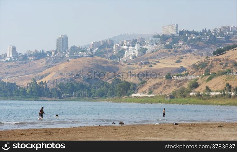 The shore of lake Kinneret near the town of Tiberias in the summer in the morning